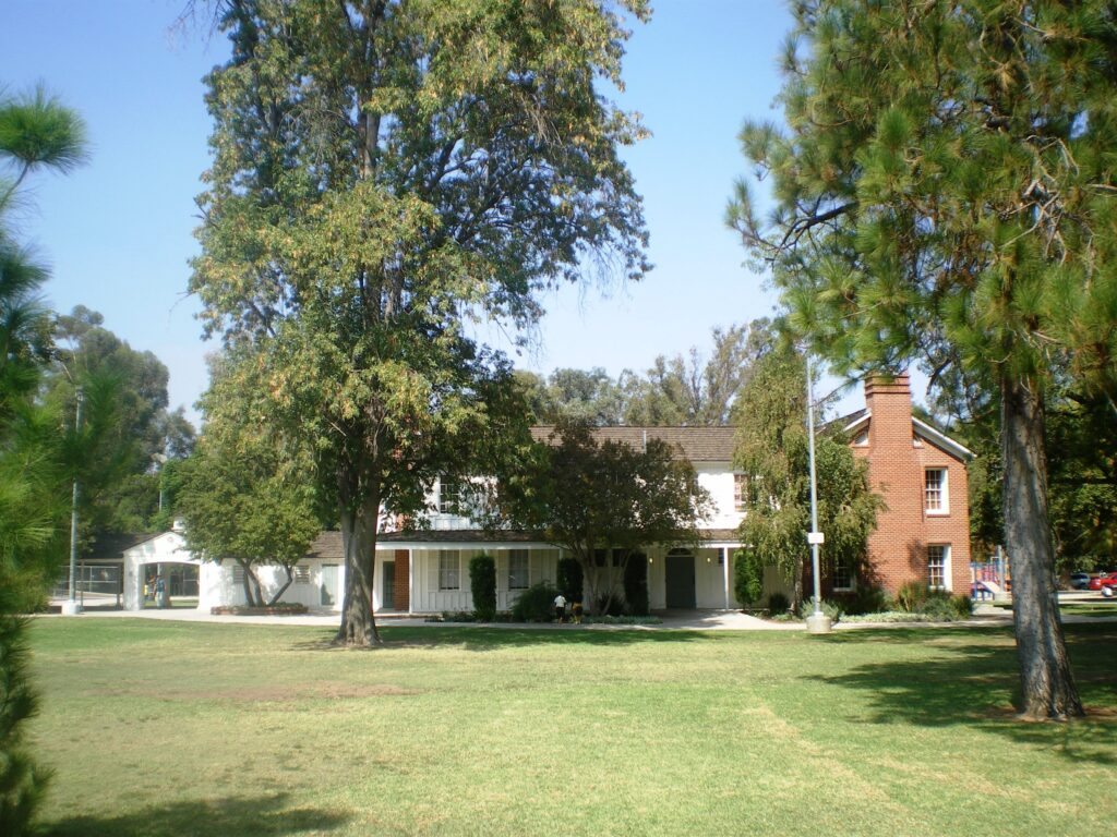 Eucalyptus trees and the historic ranch house at Shadow Ranch Park in West Hills
